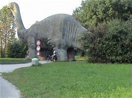 Route 3 passes under one of the enormous dinosaurs in Park im Grünen, Basel, 63.1 miles into the ride